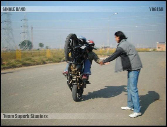 hand shaking wheelie
