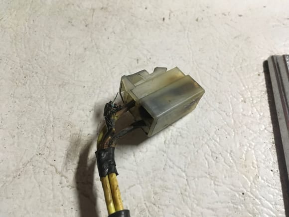 Only two of the three wires is attached.  The bottom wire in the photo is actually lacking insulation at the connector.