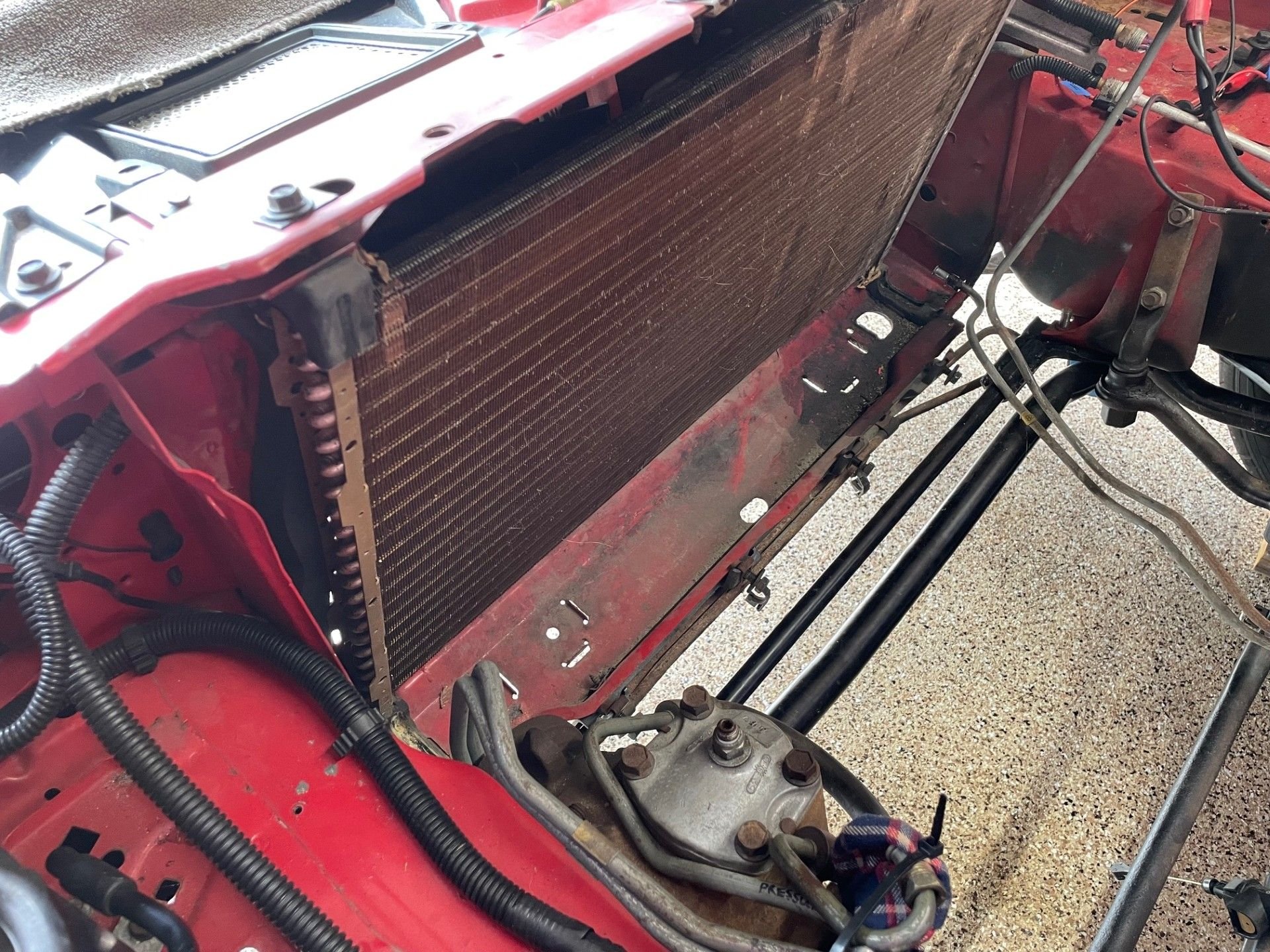 Looking at this picture, it actually looks like the OEM foam seals the AC condenser to the radiator support.  In any case, it helps funnel the air through the condenser/radiator.