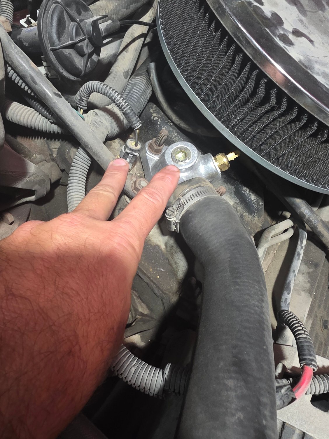 Engine temp sensor AND thermostat housing with extra ports.