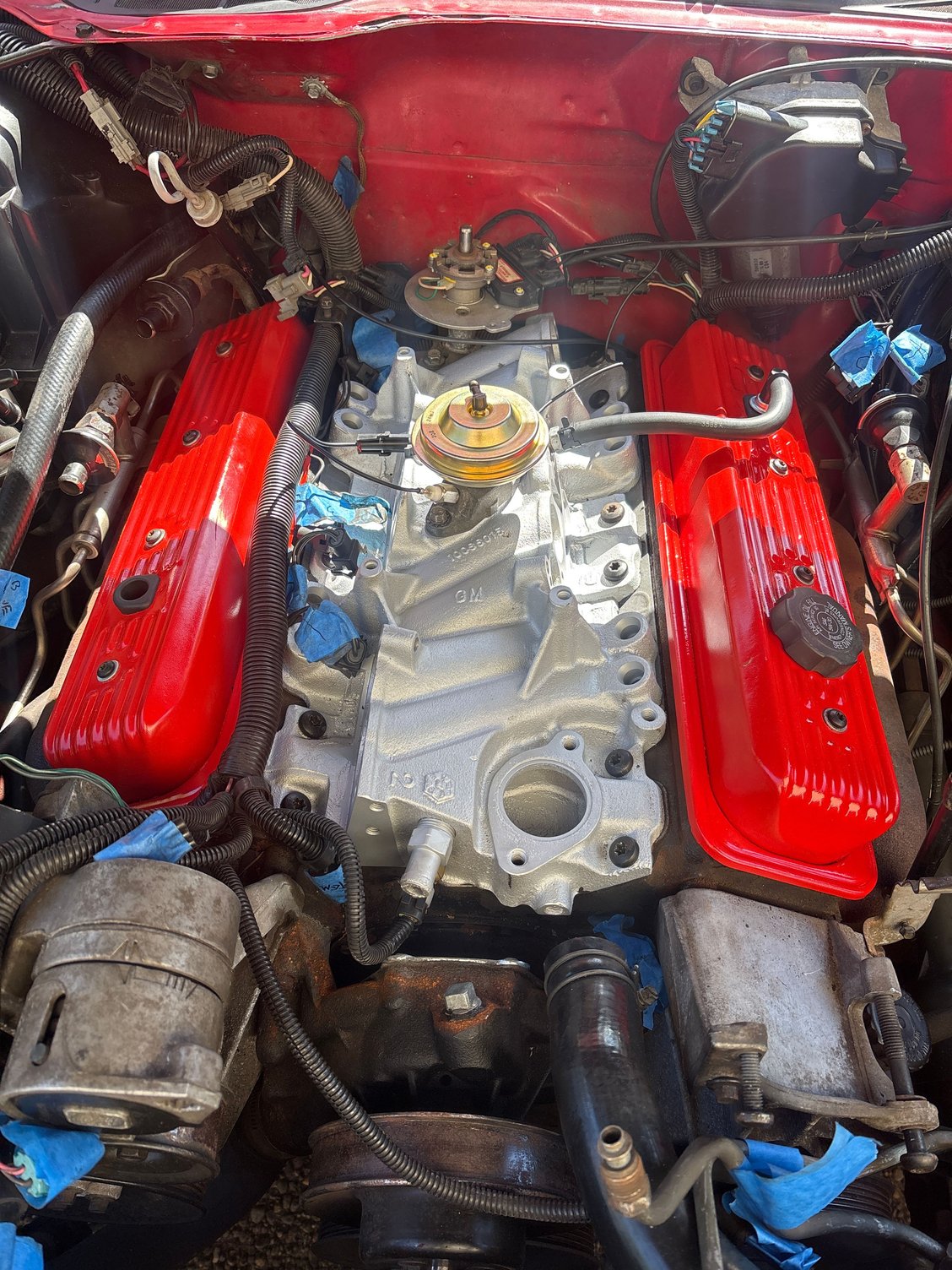 New valve covers, clean/resurfaced intake manifold, all new gaskets (obviously), new PVC valve and hose run, new temp sensor in front of intake manifold.