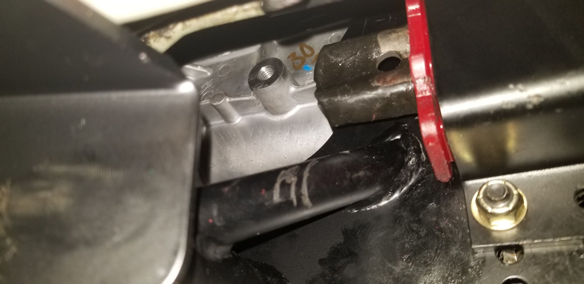 You can see where the torque arm hits the bar here... thankfully this position worked out, woulda been pretty torqued if I had to cut the arm