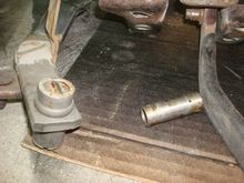 Taking the roller pin out to remove the bushings.