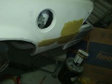 First coat of bondo on the rear of the driver quarter.