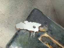 Silver paint on the back side of the emblem glue tells me it was replaced while MC was racing it.