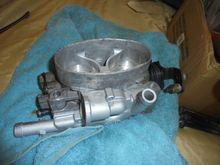 Ran the throttle body top in the ultrasonic and the lower coolant plate had been metal blasted and baked.