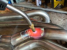 I used MAPP gas to heat it up before denting