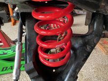 You can see that the spring is upside down.  I found Eibach installation instructions online and it says that the labeling should be right side up and the flat end of the spring should be up top.