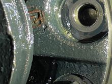 Close up of sheered bolt.