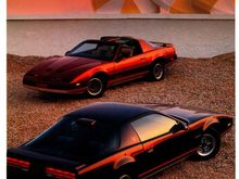 1986 Firebird S/E in Flame Red Metallic in the background.