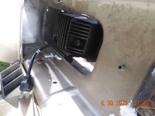 With a cutoff wheel, removed about 3 inches of the lip around the hole to allow the light bracket to seat.  Next view is from the front.