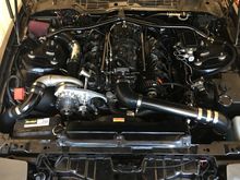 Removed engine covers due to stock hood clearance and valve cover coil covers for swapping to the 585 truck higher power coils.