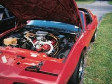 Under the hood: black engine bay, &quot;Chevy orange&quot; 383, Holley 650, I forgot most of the specs but she had around 350-375HP.. Custom 700R4, etc.