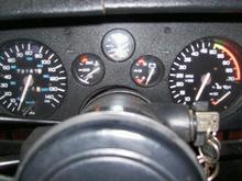 This is the irregular speedo cluster with 145mph and 5500 red line tach.