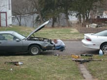 here in this picture i am putting in a new steering column in my 86 camaro from a 91 firebird.  worked like a charm.  white camaro is my girlfriends. :( it blown