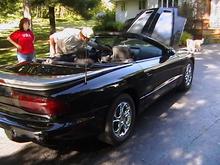 my dad lookin over the car before he buys makin sure its a good deal