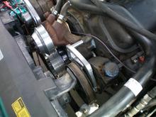 March Performance mid mount serpentine conversion (water pump/alternator overdrive ratio).  Stock PS pump re used.