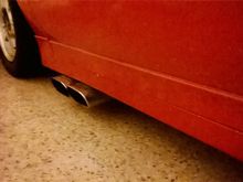 Passengers side exhaust, included.