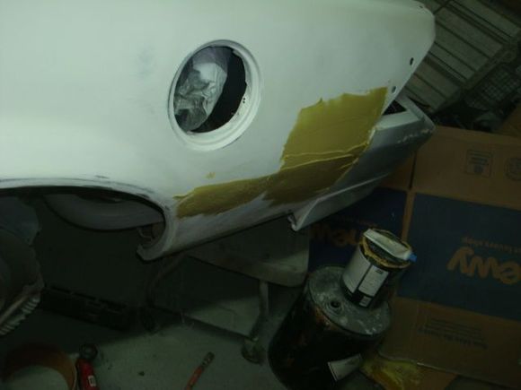 First coat of bondo on the rear of the driver quarter.