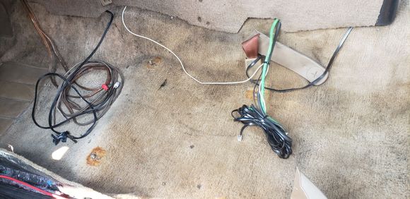 More garbage wiring.
8 gauge speaker wire split to become power and ground wires for the amp that was screwed to the bottom of the heater box in the passenger foot well.