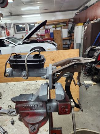 My homemade manual brake conversion...1/2" aluminum mounting plate, adjustable pushrod,  pushrod pin moved up 2", Dorman mopar master cylinder.  About $50 total.