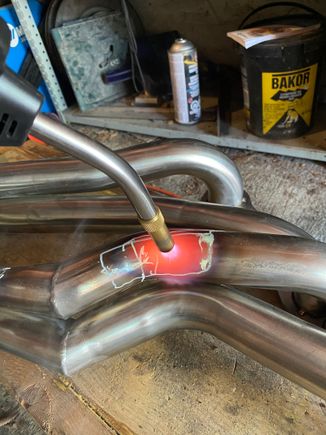 I used MAPP gas to heat it up before denting