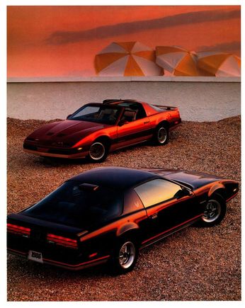 1986 Firebird S/E in Flame Red Metallic in the background.