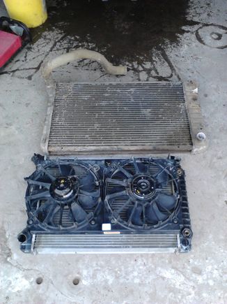 Well, here's the problem: I based all of my measurements on a V8 radiator. I thought that the V6 and V8 radiators would be the same (with the exception of core-row count), but I was wrong. This caused what would have been a 3-4 hour job into a 12 hour ordeal. As you can see here, the fans are wider than the core on the V6 radiator, so this required some modifications...