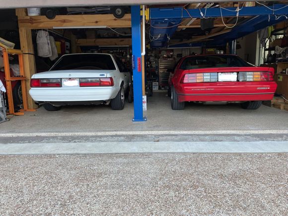 I thought that it would be a good idea to show a picture of both of my cars in the garage.