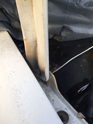Passenger side hood hinge.