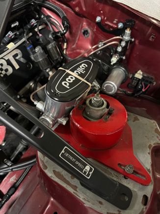 Wilwood MC on the hydraboost.  There's just no room with that strut cap which Shifty experienced with his baer remaster.  Ill do the same thing he did with cutting a relief into the cap and welding a flat plate in.