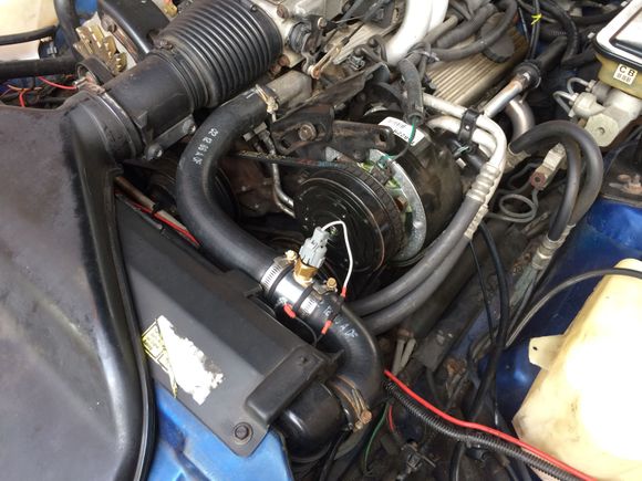 Autometer 2283 with a TS-136 temperature switch for the driver fan.