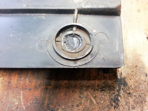 Studs removed with needle nose and then ground down with a carbide bit.