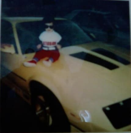 Me on my dad's brand (then) new 1987 yellow iroc-z. Wish he still had that car...
