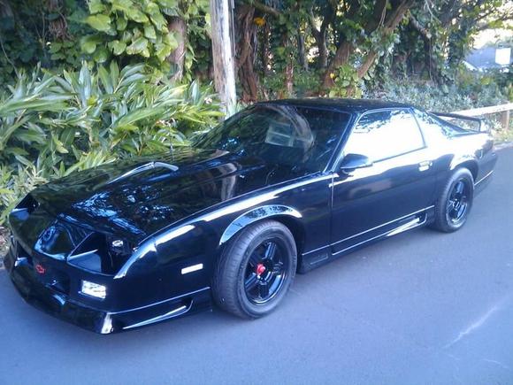 Windows blacked out, fresh paint, chrome tips and headers, new headliner and speaker panels wrapped in red suede. We're getting there!