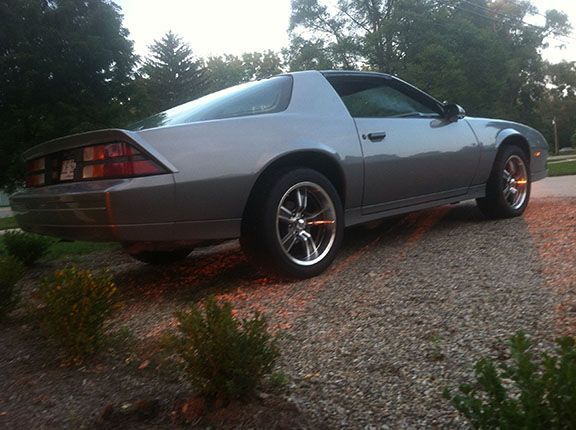 Camaro with new wheels and tires before hood work and black decals