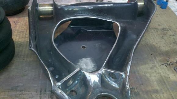 Arm with spring cup cut out and gussets