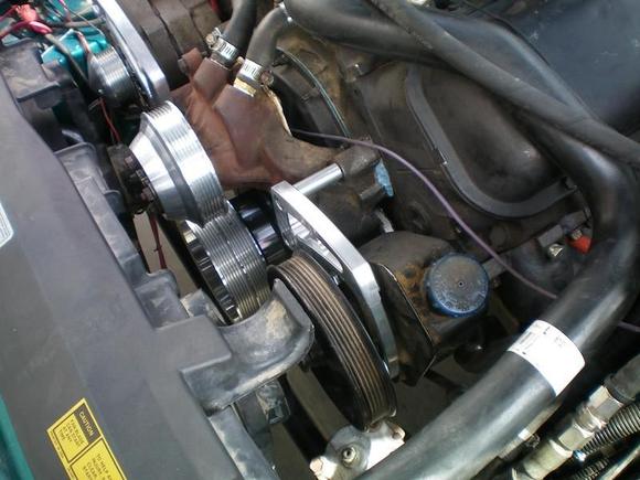 March Performance mid mount serpentine conversion (water pump/alternator overdrive ratio).  Stock PS pump re used.
