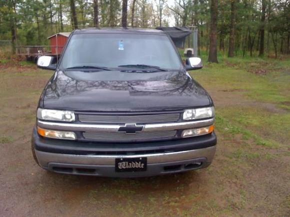 the front end with the billet grill and black bowtie