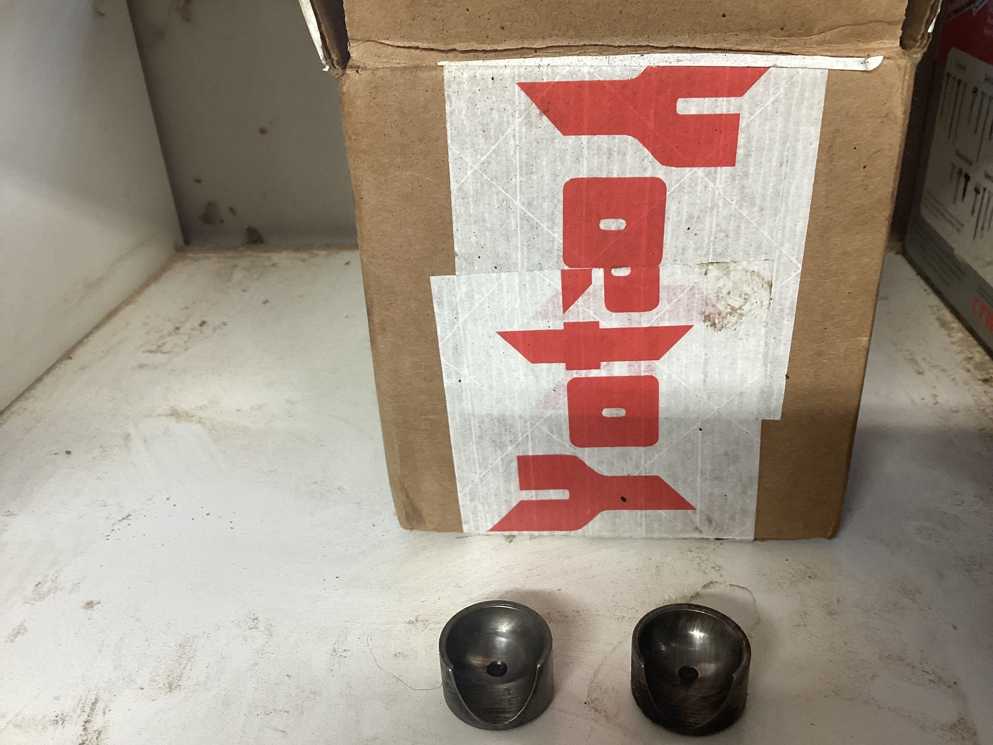 Check out the wear on these two spring backed pieces that sit on either side of the knuckle arm ball inside the drag link. The same pieces on the pitman arm end show very little wear. 