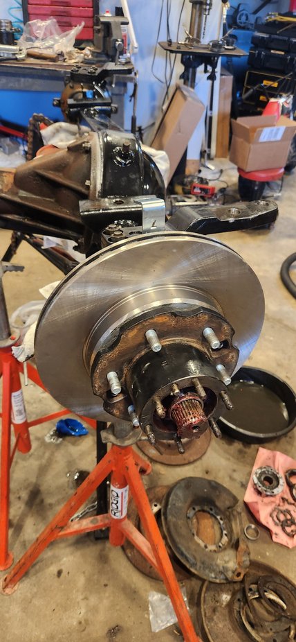 Hub on axle. It is a pretty tight fit on the dust seal to hub surface. It takes a decent amount of force and some light rocking movement for it set in place inside the seal on knuckle.