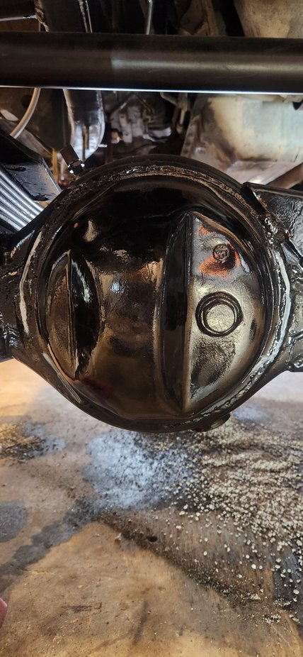 One U bolt needs to come out to be out the way for welding. Held cover up and roughly marked it. Wire wheel just where i needed to. Wanted to remove as little paint as possible from the axle.