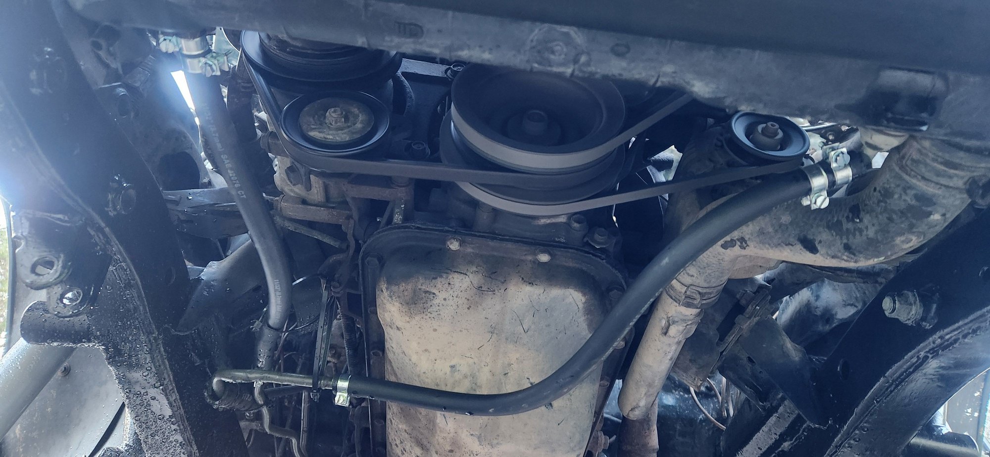 New hose back in place on both lines. Not happy about it but it is better then before with no support at all. I added ziptie hangers and some hose between them where they had been rubbing against each other. Topped off atf fluid.