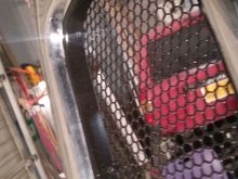 Literally cut out a bunch of the plastic and moved the depth forward and just zip tied the honeycomb mesh in place