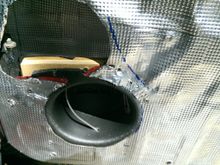 MDF Ring and baffle installed with coated deck screws.  You can see the blue sharpie swoop of the window crank and the door hinge stop at the top left (as well as the interior sound deadening)