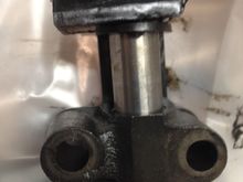 The chain tensioner note the hole in the end that guides the chain