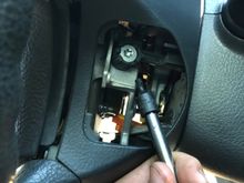 loosen the two torque head screws on either side of the wheel, this will allow removal of the airbag.  