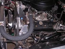 I used a 15" flex fan w/spacer kit. I would rather have used an electric puller but lacked the 4 1/4" needed to clear it because I wanted the transfer case to stay in the stock location.