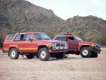 My Uncle's Rig "Rudy" up front (ridiculousness under that hood) And my Rig in the back "Brown Eye." Have yet to start the build but have definitely started deconstruction.
