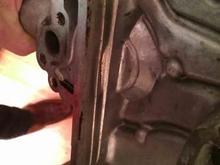 Worn through timing chain cover.  The scary thing is that I didn't have a dual row chain....the two very different distinct wear lines are from the thrust bearings coming out and the crank had 1/4" of play front to back in it!  That's what ultimately trashed the block.